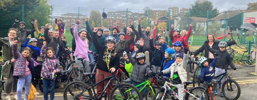 Adults and children on their bikes